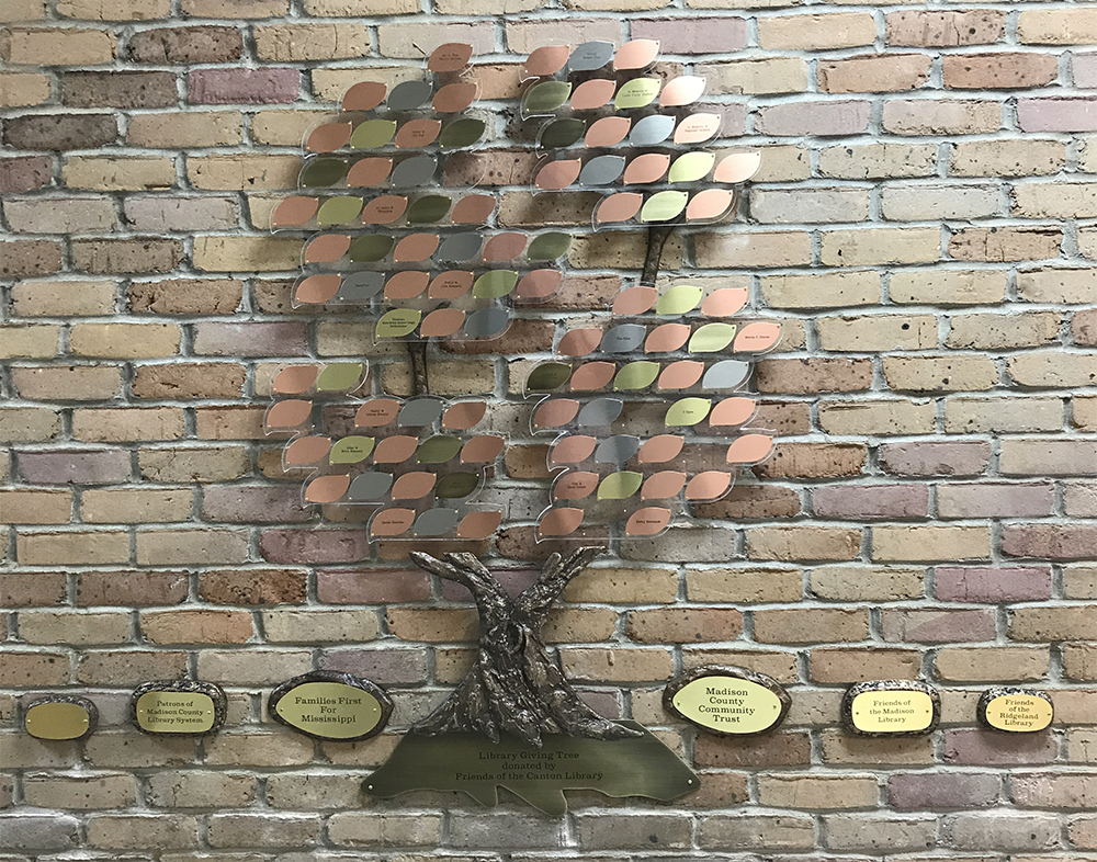 A gold, silver, and copper 100 leaf tree.
